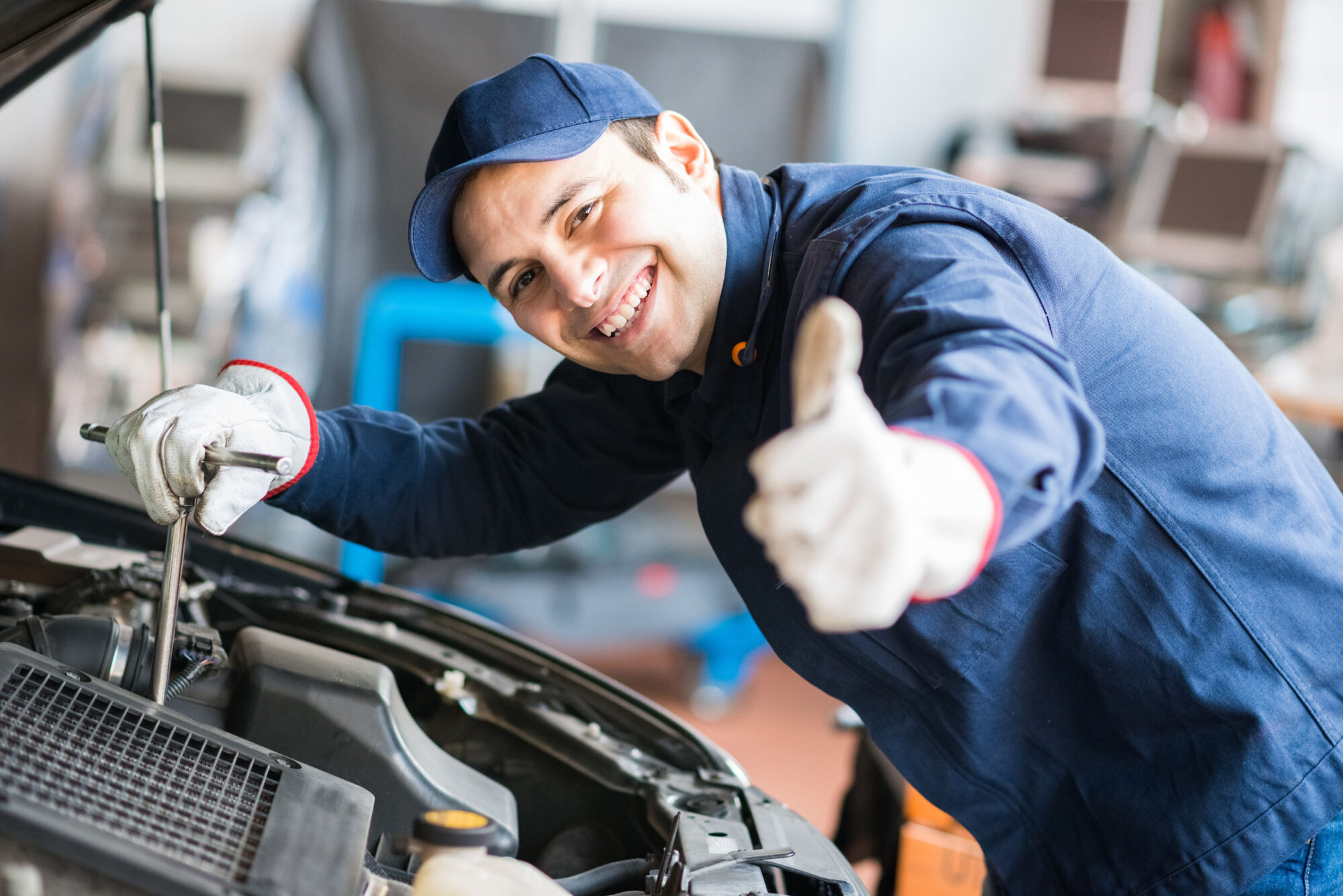 41808619 – portrait of an auto mechanic at work on a car in his garage